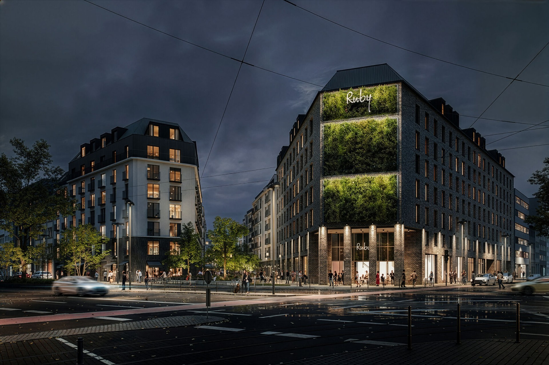 Beleuchtete Fassade des MAIN YARD Quartiers bei Nacht